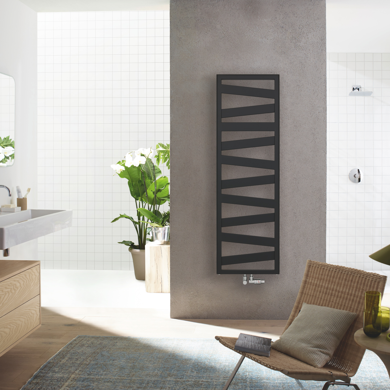 Zehnder_RAD_Ribbon-HY_160_050_black_Connection_Exclusive_chrome_middle_withChair_inInterior_print+web Rendering Decorative radiator